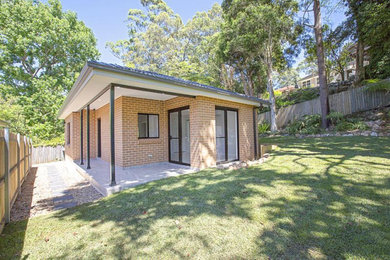 Photo of a small contemporary detached granny flat in Sydney.