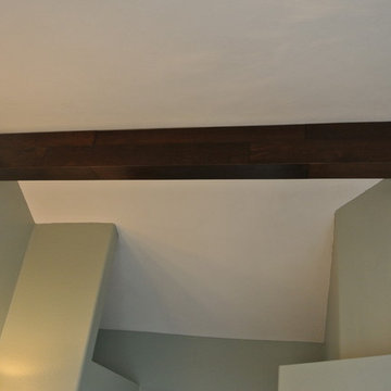 Drywall Ceiling Beams Wrapped in Distressed Hardwood Flooring