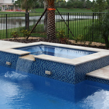 Custom Pool & Spa with Partially Raised Spa, and Fire Bowls in Boynton Beach