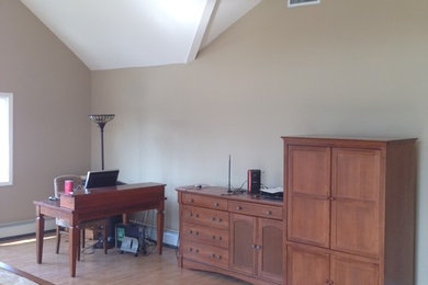 Bedroom - large contemporary master light wood floor bedroom idea in New York with beige walls