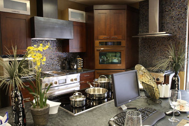 Design ideas for a modern kitchen with stainless steel appliances and with island.