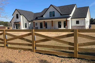 Example of a farmhouse exterior home design in Other