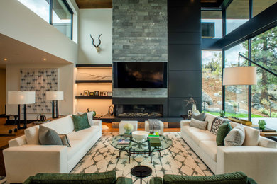 Trendy medium tone wood floor, brown floor and wood ceiling living room photo in Other with white walls, a ribbon fireplace and a wall-mounted tv