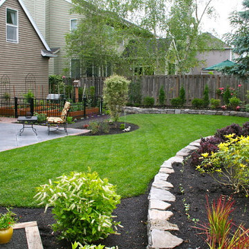 AFTER: Smaller lawn, new patio & plantings