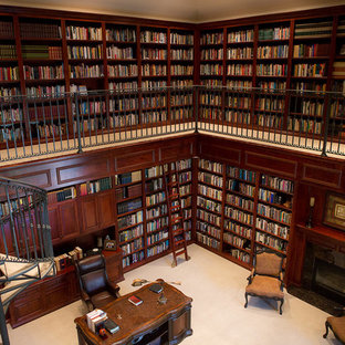 Photo of an expansive victorian home office and library in Other with a reading nook, brown walls, carpet, a standard fireplace, a tiled fireplace surround, a freestanding desk and grey floors.