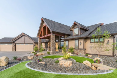Inspiration for a large craftsman beige two-story mixed siding exterior home remodel in Seattle with a shingle roof