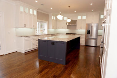 Example of a large transitional u-shaped dark wood floor and brown floor eat-in kitchen design in DC Metro with an undermount sink, recessed-panel cabinets, white cabinets, quartzite countertops, beige backsplash, ceramic backsplash, stainless steel appliances, an island and multicolored countertops