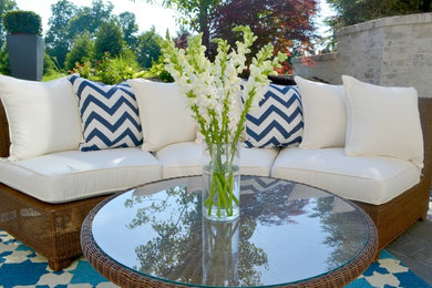 Inspiration for a mid-sized transitional backyard stone patio remodel in Indianapolis with no cover