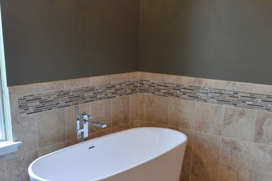 Inspiration for a mid-sized eclectic master beige tile and porcelain tile porcelain tile bathroom remodel in Philadelphia with an undermount sink, shaker cabinets, dark wood cabinets, solid surface countertops, a one-piece toilet and green walls