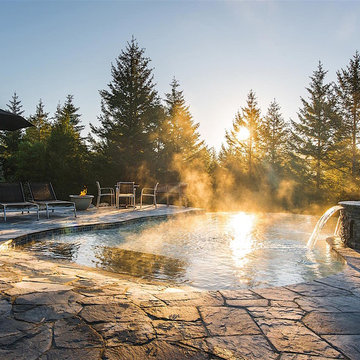 Vanishing Edge Concrete pool with spa and water feature