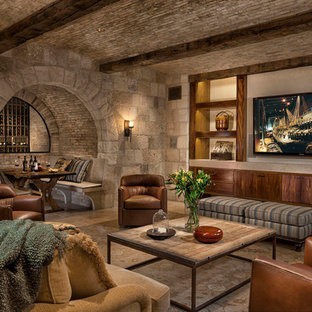 Design ideas for a mediterranean fully buried basement in Orange County with beige walls and beige floors.