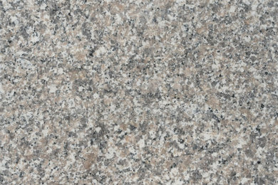 Honed Bianco Sardo granite, fine grey speckle with pink and tan grains