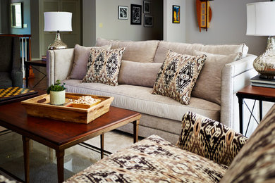 Large trendy open concept carpeted living room photo in Other with gray walls, a two-sided fireplace, a stone fireplace and a media wall