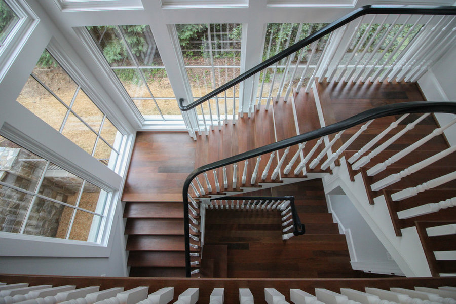 Powerful Impression by Floating Staircase in Suburban Foyer