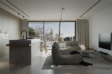 Modelo de salón abierto minimalista grande con paredes blancas, suelo laminado, televisor colgado en la pared y suelo beige