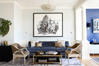 This is an example of a large transitional living room in San Francisco with white walls and light hardwood floors.