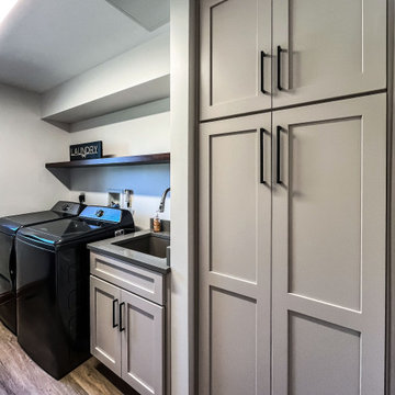 Laundry Room with Custom Cabinetry Quartz Countertop and Custom Floating Shelf