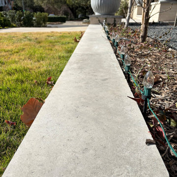 Concrete Curb Edge With Bed Lights and Large Planter