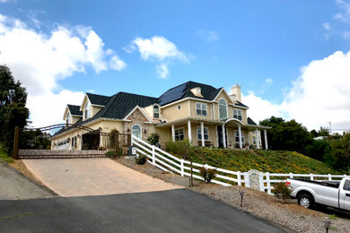 Farmhouse exterior home idea in San Diego