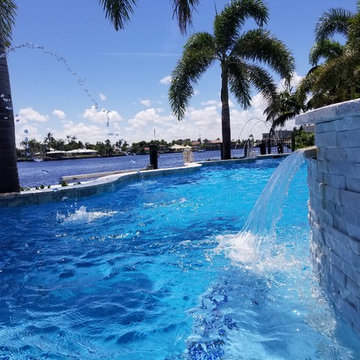 Custom Shaped Pool with Sun Shelf, Spa and Laminar Deck Jets in Pompano Beach