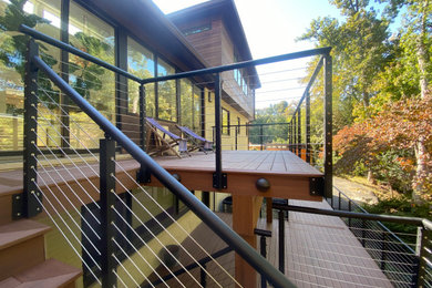Example of a trendy backyard metal railing deck design in DC Metro