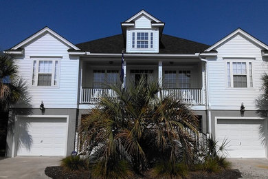 Inspiration for a coastal concrete fiberboard exterior home remodel in Other