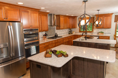 Huge transitional l-shaped porcelain tile and white floor eat-in kitchen photo in Other with an undermount sink, flat-panel cabinets, medium tone wood cabinets, quartz countertops, white backsplash, ceramic backsplash, stainless steel appliances, two islands and white countertops