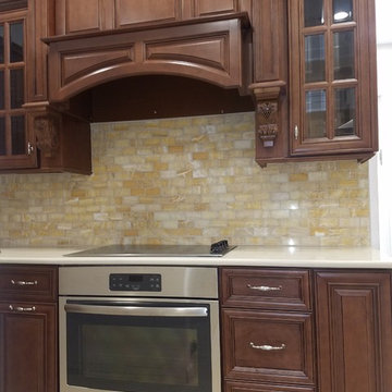 Custom kitchen with lattice wine rack cabinet.