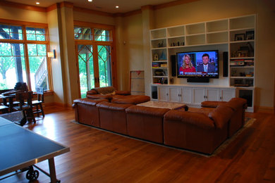 Inspiration for a mid-sized timeless open concept medium tone wood floor living room remodel in Bridgeport with yellow walls, no fireplace and a wall-mounted tv