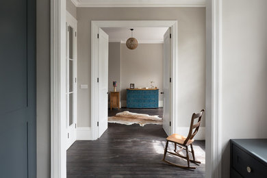 This is an example of a transitional hallway in London with grey walls.