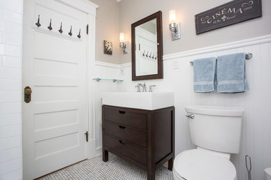 Corner shower - mid-sized contemporary 3/4 white tile and subway tile marble floor corner shower idea in Minneapolis with flat-panel cabinets, dark wood cabinets, solid surface countertops, a two-piece toilet, beige walls and an integrated sink