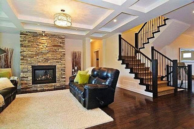 This is an example of a large traditional formal open concept living room in Vancouver with beige walls, dark hardwood floors, a standard fireplace, a stone fireplace surround, no tv and brown floor.
