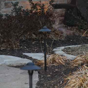 Deck lighting using low voltage under railing LED lights.