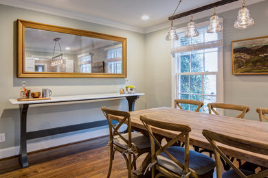 Dining room - transitional dark wood floor dining room idea in Other