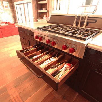 Island Cooktop with Pot Filler Behind and Utensil Drawer Under