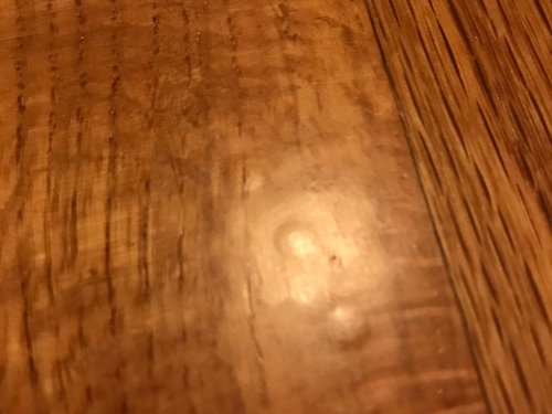 Hardwood Floor Just Refinished Bumps, How To Remove Paper Stuck Hardwood Floor
