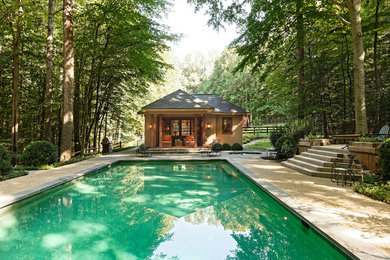 Pool house - farmhouse backyard rectangular pool house idea in DC Metro