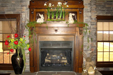 Large elegant family room photo in Other with a standard fireplace and a stone fireplace