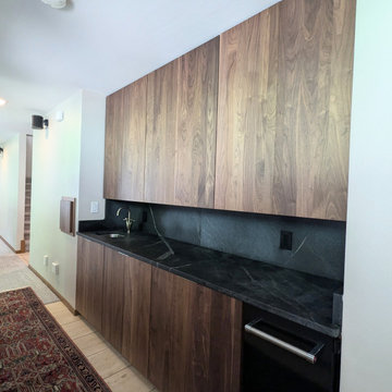 Contemporary Kitchen Remodel Done in a Walnut Slab Door