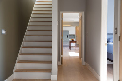 Basement - mid-sized modern walk-out basement idea in San Francisco with gray walls