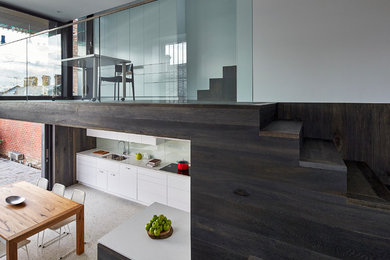 This is an example of a contemporary wood staircase in Melbourne with wood risers.