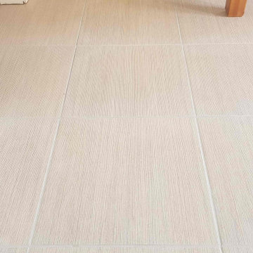 Patchy Grout on Porcelain Floor Restored in Darton New Build