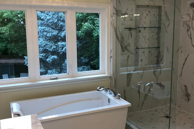 Mid-sized transitional master white tile and ceramic tile ceramic tile and white floor bathroom photo in Toronto with yellow walls, an undermount sink, marble countertops, a hinged shower door, white countertops, shaker cabinets, white cabinets and a one-piece toilet