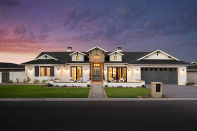 Mid-sized transitional white one-story stucco exterior home photo in Phoenix with a shingle roof