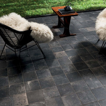 Contemporary backyard pool with dark grey stone look porcelain tiled floors