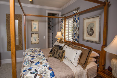 Large beach style master carpeted bedroom photo in Jacksonville with gray walls