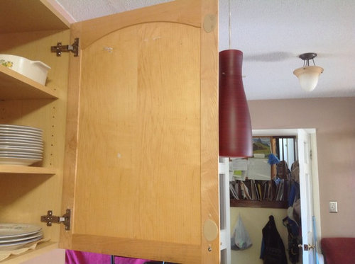 How do you keep a cupboard door from opening too wide?