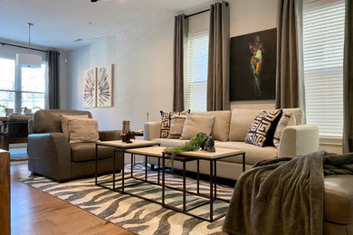 Living room - mid-sized transitional open concept medium tone wood floor living room idea in Cincinnati with gray walls