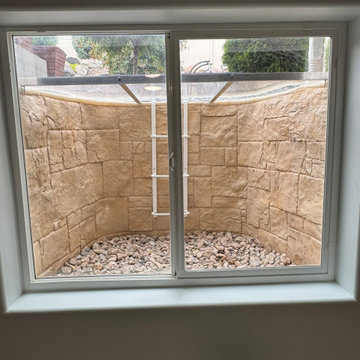 New basement window wells, new rok back fill, liner and covers.