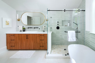 Mid-sized minimalist master green tile and ceramic tile porcelain tile, white floor and single-sink bathroom photo in Boston with flat-panel cabinets, brown cabinets, quartzite countertops, white countertops, a built-in vanity, a niche and an integrated sink